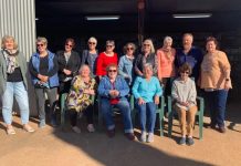 Quilters help others with their work